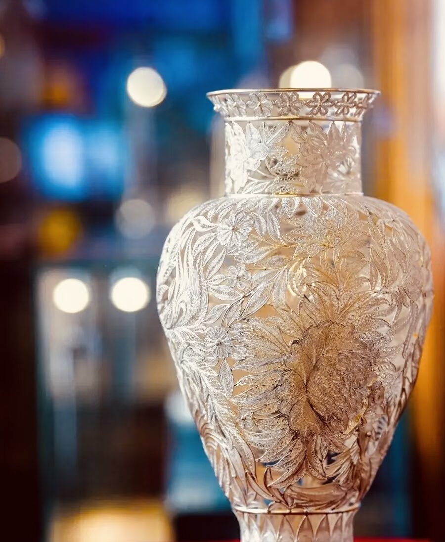 The Hands Behind the Object — Why Provenance Still Matters 5 A stunning silver vase with elaborate floral engravings, showcasing exceptional craftsmanship.