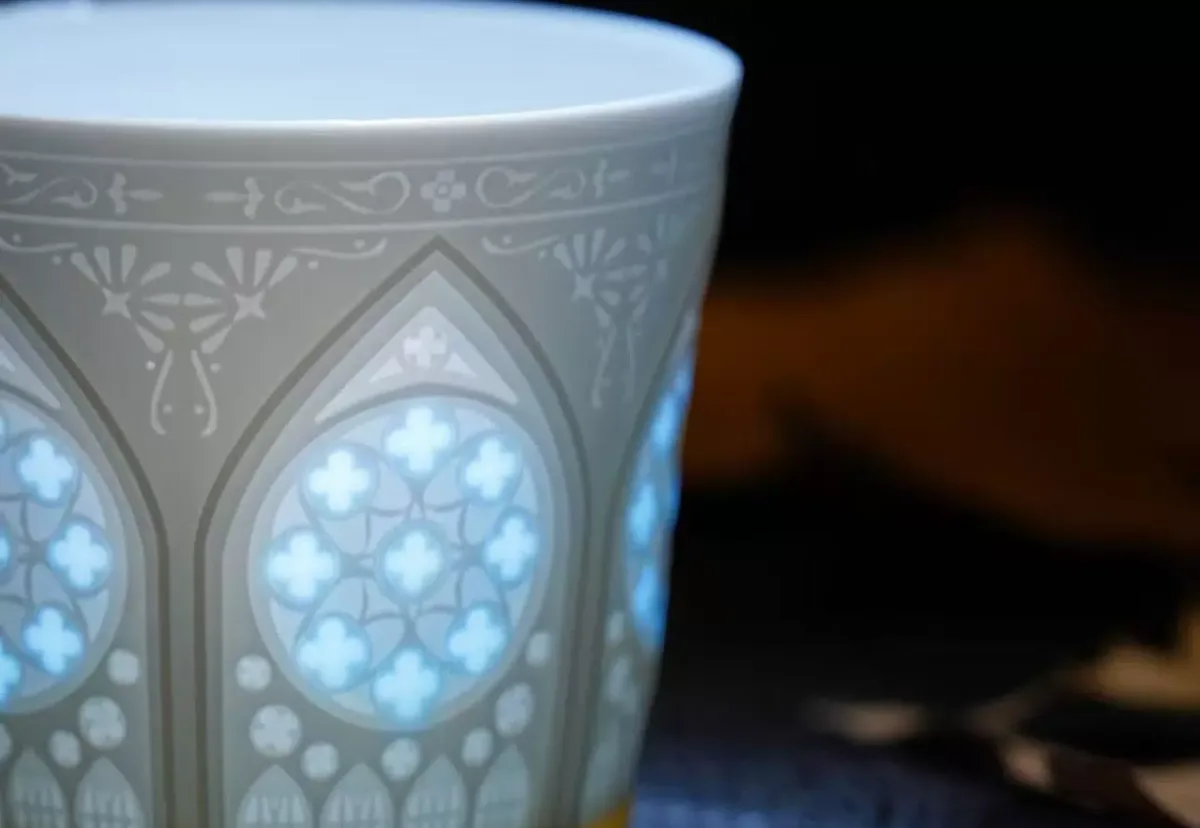 Artisan Linglong Porcelain Light & Shadow Cup in blue — craftsmanship close-up
