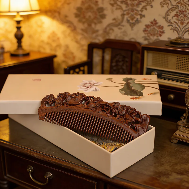 Close view of a carved ebony comb with visible tooth spacing