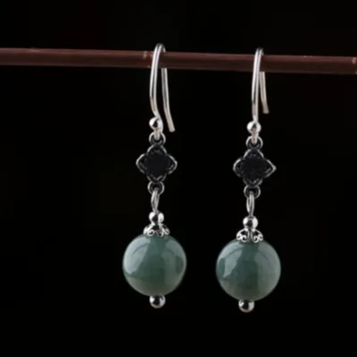 Sterling silver emerald green bead earrings side view with handcrafted details