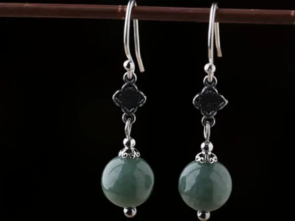 Sterling silver emerald green bead earrings side view with handcrafted details