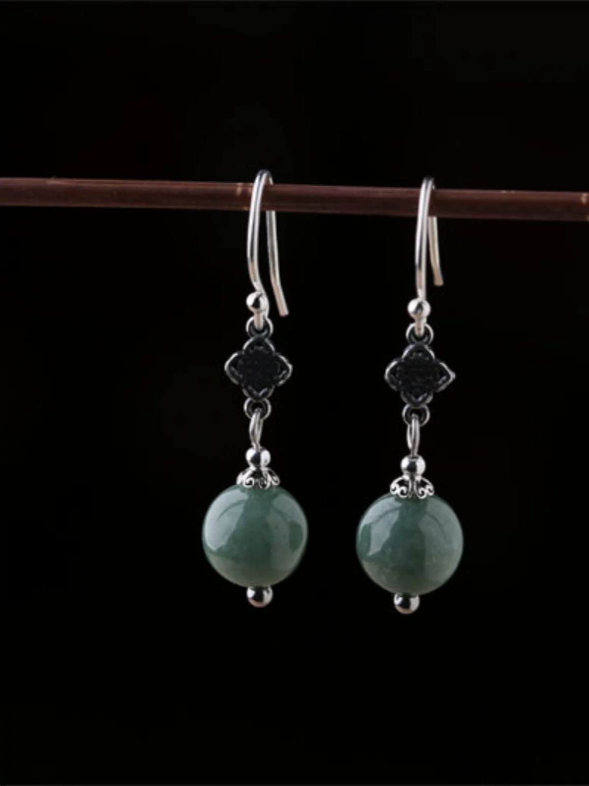 Sterling silver emerald green bead earrings side view with handcrafted details
