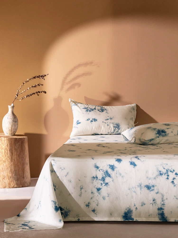 Handmade indigo plant cloud dyeing cotton and linen four-piece set detail view showing 100% grade 6a mulberry silk texture...