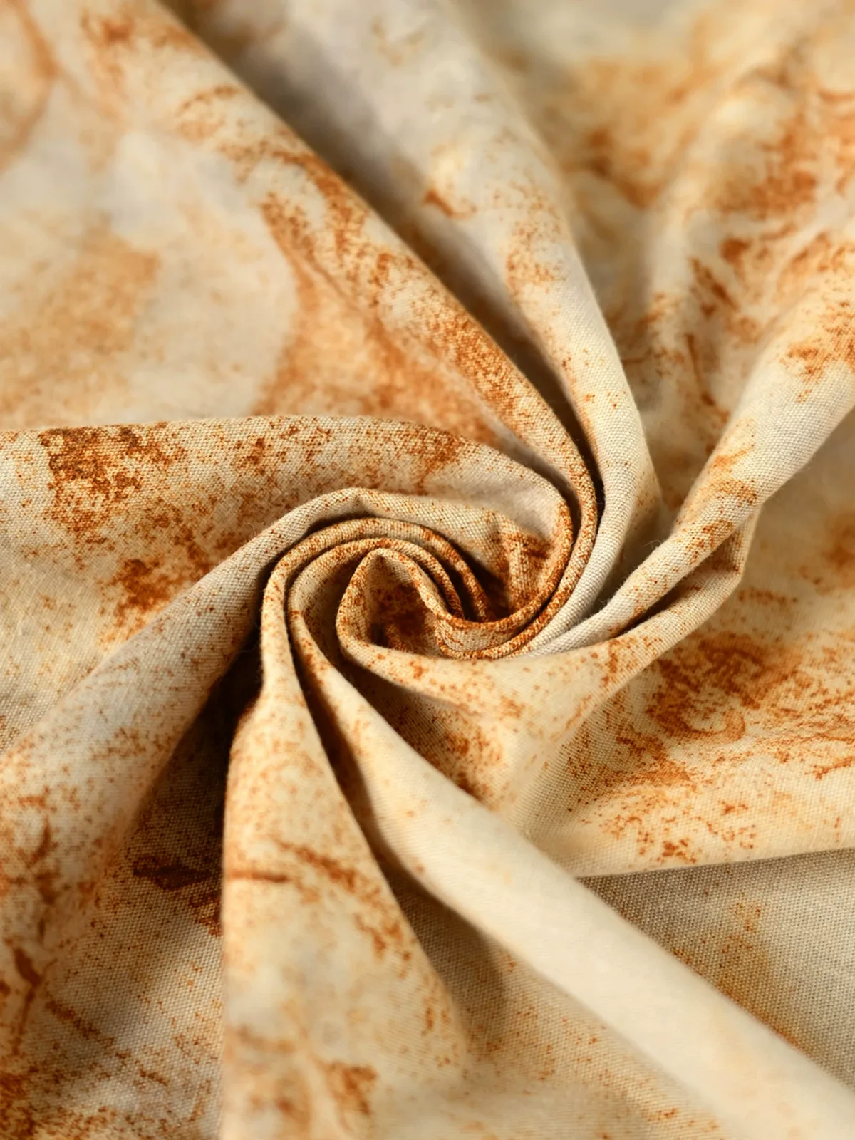 Plant-dyed cotton fabric in earthy rust-brown variation