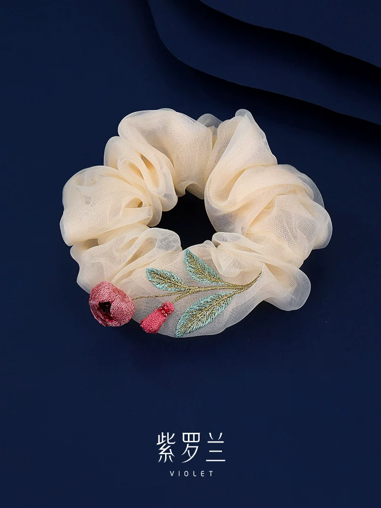 Artisan Camellia Silk Scrunchie Quiet Bloom in 100% mulberry silk with hand-stitched floral motif