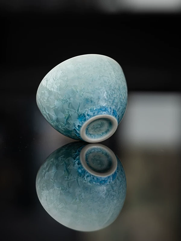 Blue glaze teacup detail showing shifts in glaze density