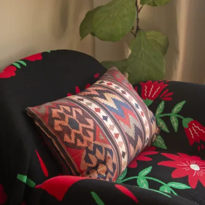 Bohemian Heavy Linen Lumbar Pillow showing tea-dyed textile and handmade bag detail
