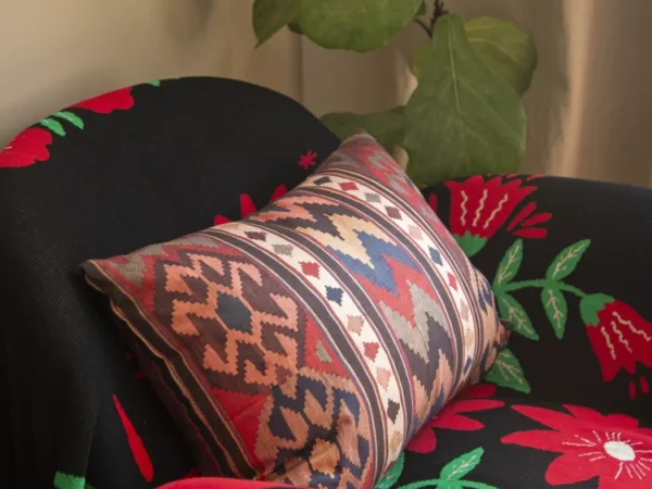 Bohemian Heavy Linen Lumbar Pillow showing tea-dyed textile and handmade bag detail