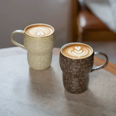 Carved Ceramic Coffee Mug showing carved relief ceramic surface texture