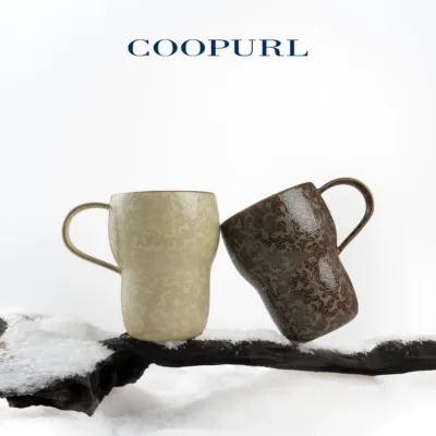 Carved Ceramic Coffee Mug showing carved relief ceramic surface texture