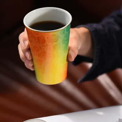 Carved Ceramic Tumbler Mug showing carved relief ceramic surface texture
