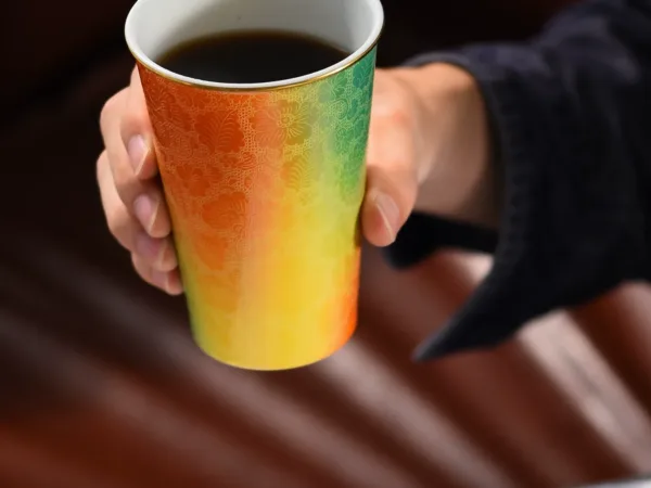 Carved Ceramic Tumbler Mug showing carved relief ceramic surface texture