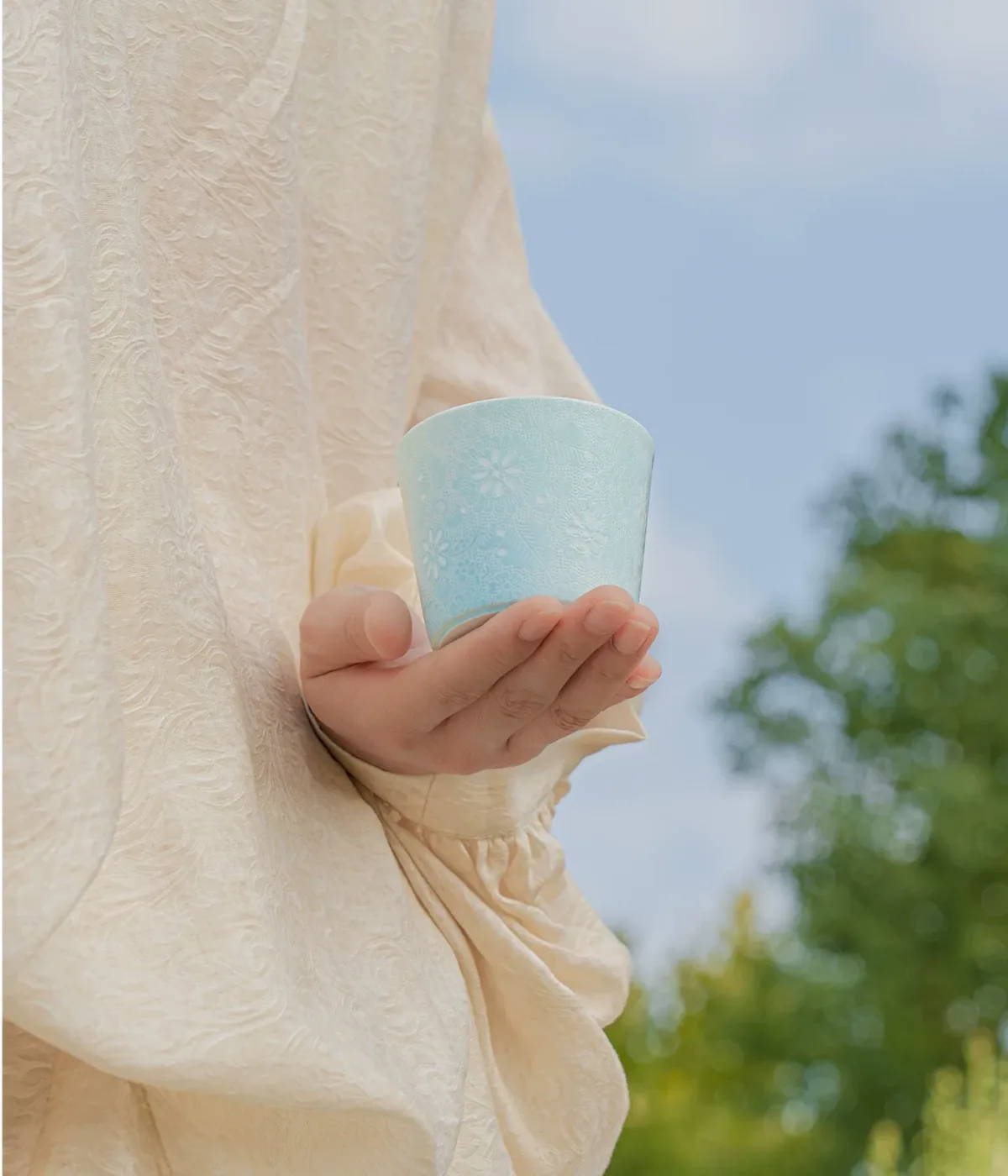Carved Rice Grain Porcelain Coffee Mug showing rice-grain translucent porcelain ceramic craft