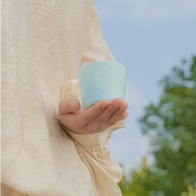Carved Rice Grain Porcelain Coffee Mug showing rice-grain translucent porcelain ceramic craft