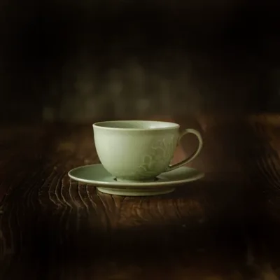 Celadon Lotus Ceramic Coffee Mug showing ceramic craft and surface detail