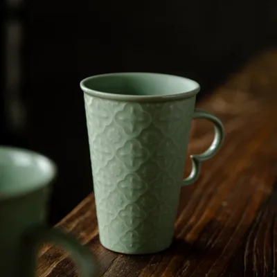 Celadon Relief Ceramic Coffee Mug showing ceramic craft and surface detail
