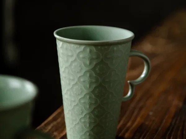 Celadon Relief Ceramic Coffee Mug showing ceramic craft and surface detail