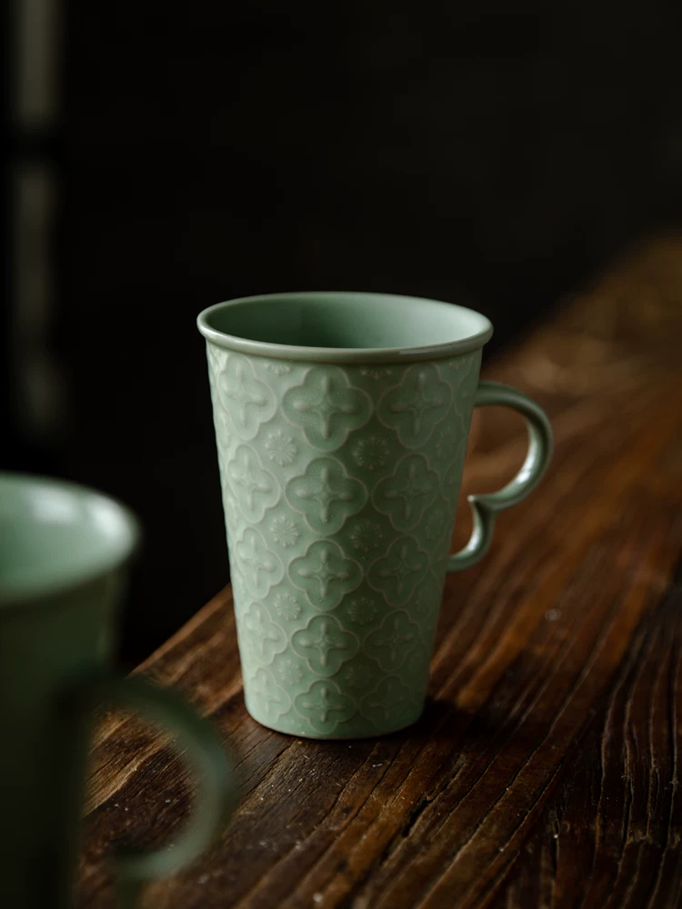 Celadon Relief Ceramic Coffee Mug showing ceramic craft and surface detail