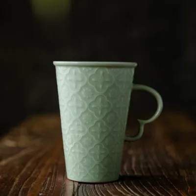 Celadon Relief Ceramic Coffee Mug showing ceramic craft and surface detail