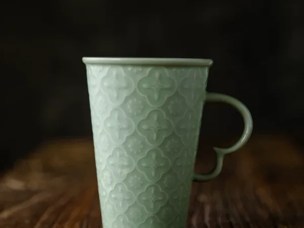 Celadon Relief Ceramic Coffee Mug showing ceramic craft and surface detail