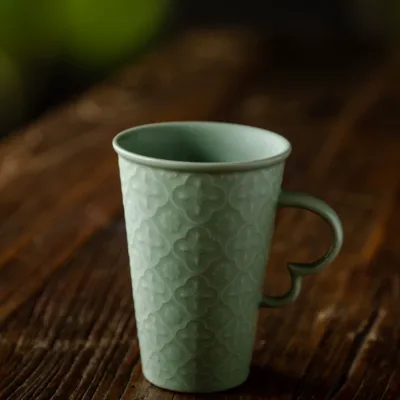 Celadon Relief Ceramic Coffee Mug showing ceramic craft and surface detail