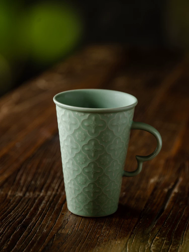 Celadon Relief Ceramic Coffee Mug showing ceramic craft and surface detail