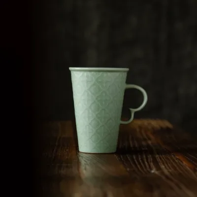 Celadon Relief Ceramic Coffee Mug showing ceramic craft and surface detail