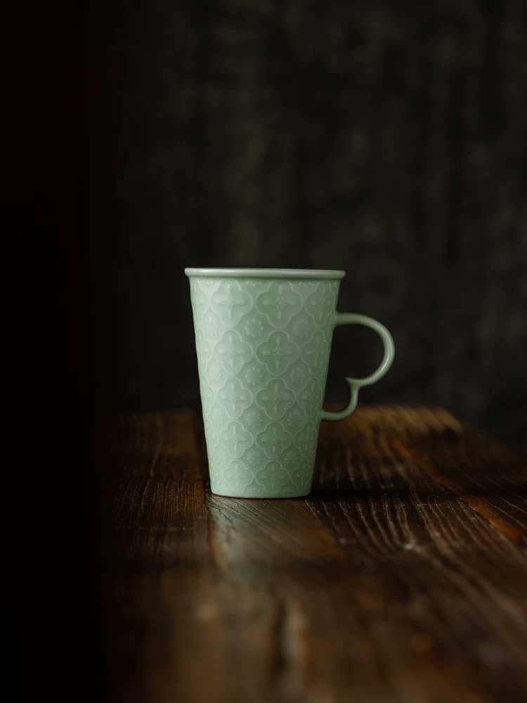 Celadon Relief Ceramic Coffee Mug showing ceramic craft and surface detail