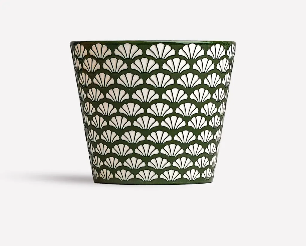 Ginkgo relief ceramic mug showing carved surface texture and handmade ceramic detail