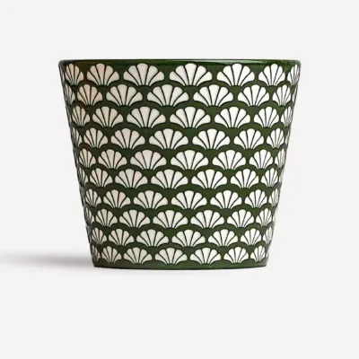Ginkgo relief ceramic mug showing carved surface texture and handmade ceramic detail