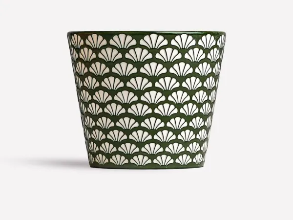 Ginkgo relief ceramic mug showing carved surface texture and handmade ceramic detail