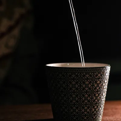 Lucky Relief Ceramic Coffee Mug showing carved relief ceramic surface texture