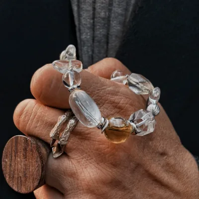 White crystal essential oil bracelet showing clear crystal beads and guardian energy styling