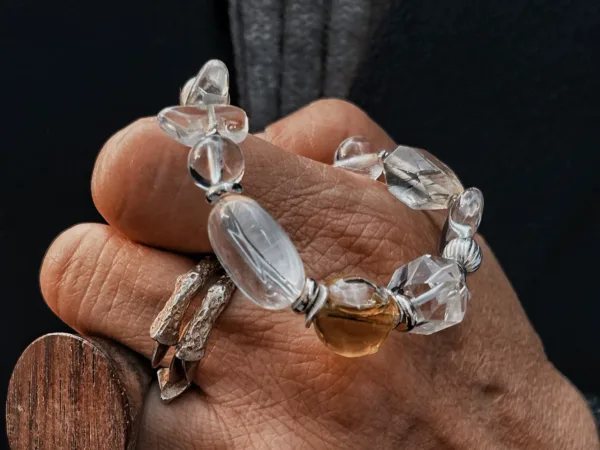 White crystal essential oil bracelet showing clear crystal beads and guardian energy styling