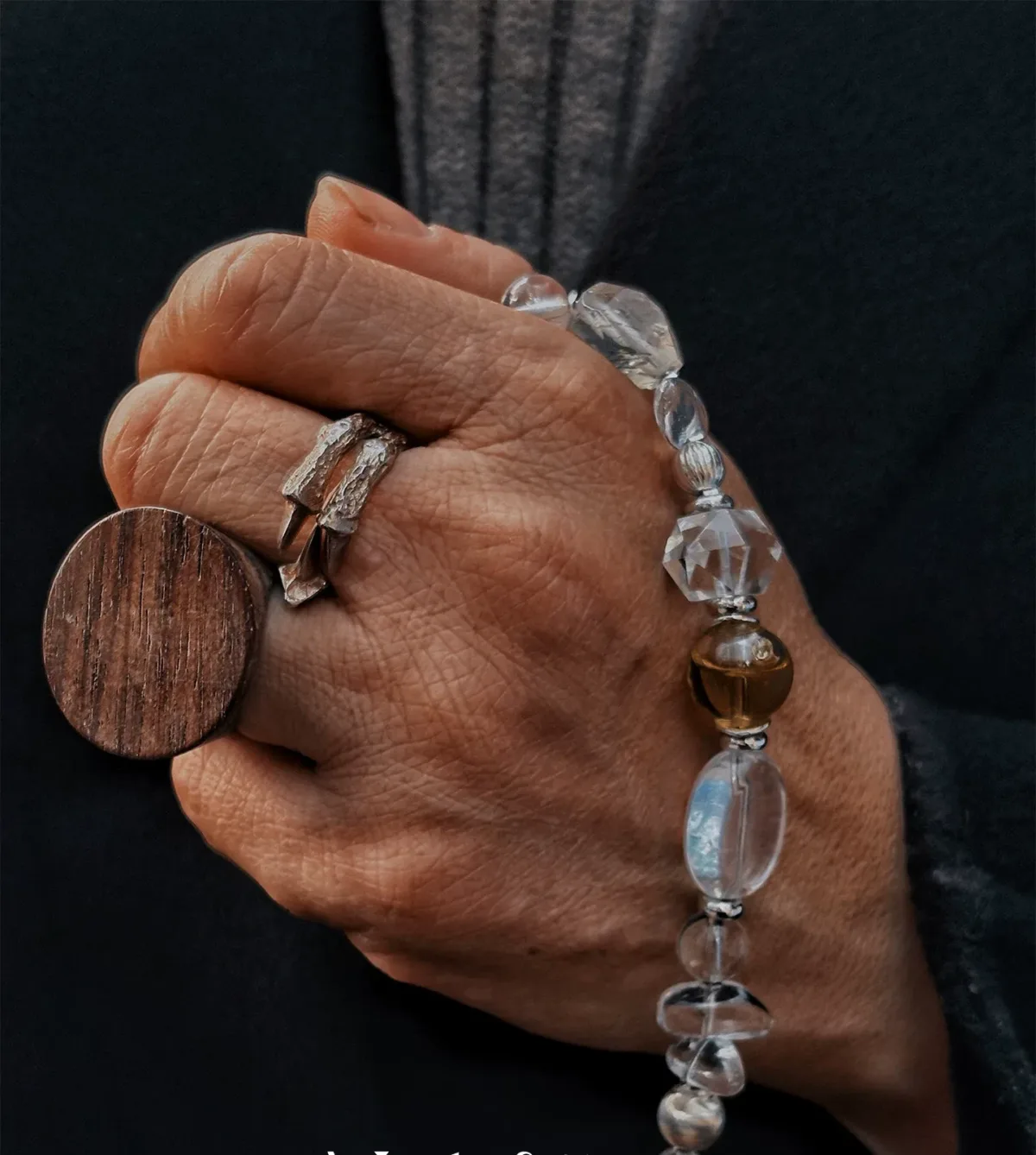 White crystal bracelet detail showing wearable essential oil diffuser design