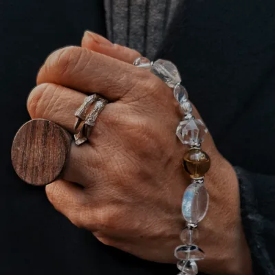 White crystal bracelet detail showing wearable essential oil diffuser design