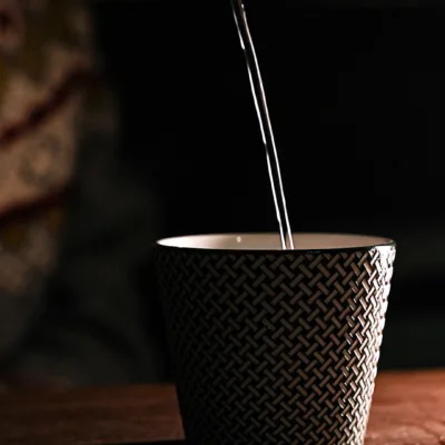 Woven Pattern Relief Ceramic Coffee Mug showing carved relief ceramic surface texture